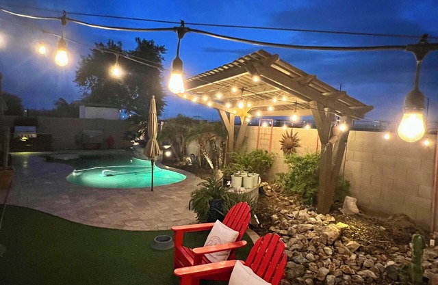 A pet-friendly cozy 4 bedroom home with a resort style pool in the backyard.