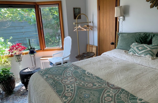 A shady retreat within a flower garden, with a boutique hotel feel. Close in