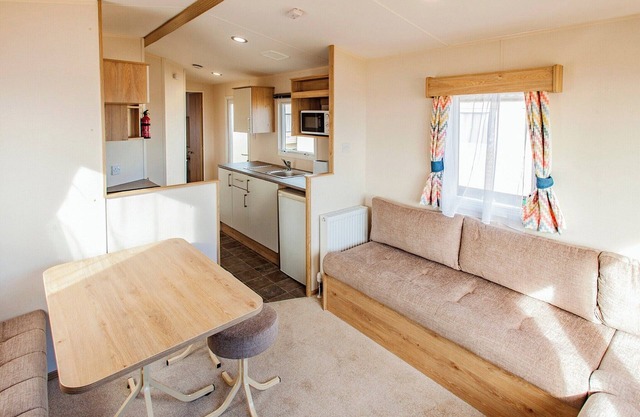 A spacious caravan with one master double and one twin room.