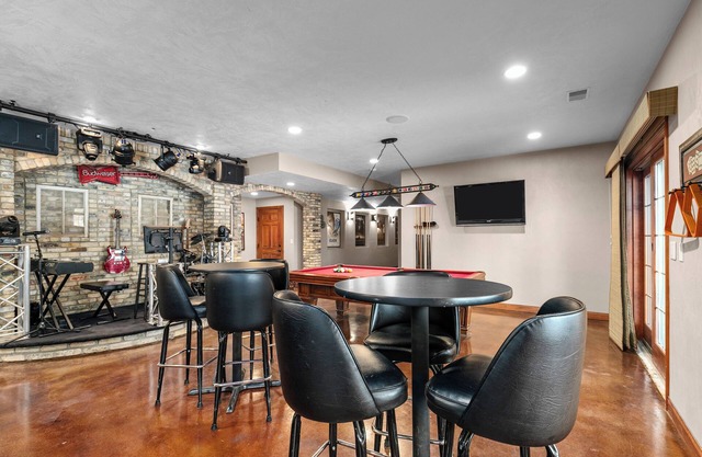 A warm & inviting modern retreat featuring on-site local brews & a home theater.