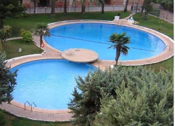 Acogedor apartamento en Daimús a 150 metros de la playa con parking privado y piscinas comunitarias