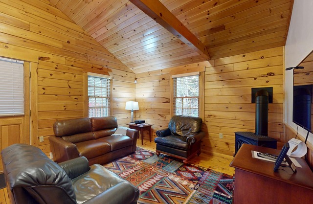 Adventure starts here in this dog-friendly cabin with kitchen, firepit & trails