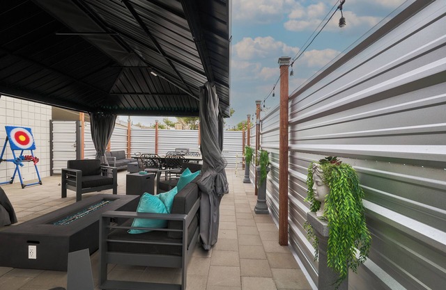 Alexander Teal Modern Home With Outdoor Fire-pits & Life Size Games!