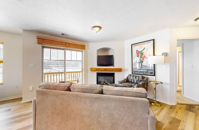 Amazing lake view condo w/ fireplace, balcony, shared pool & hot tub