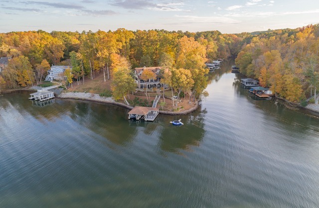 AMAZING PANORAMIC LAKE GASTON VIEWS IN THIS EXECUTIVE 6 BEDROOM HOME