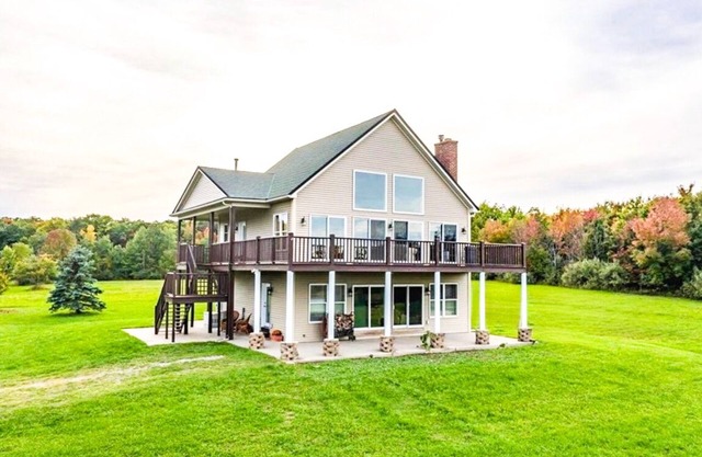 Amenity packed home set on 40 acres with sweeping views of Canandaigua Lake.