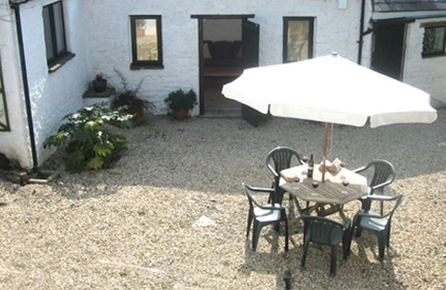 ancient stone detached structure with own walled courtyard