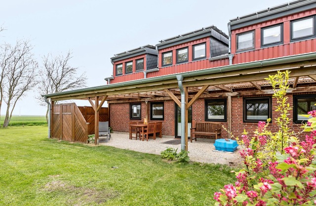 Ferienwohnung Seehund mit Gemeinschaftsgarten, überdachte Terasse und WLAN