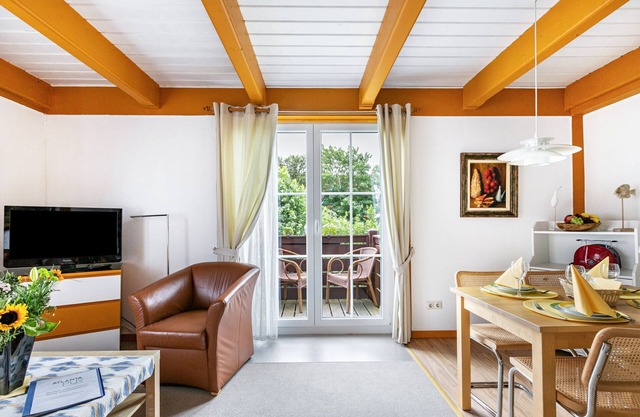 Ferienwohnung 'Atlanta 103' mit gemeinsamer Terrasse, privatem Garten und WLAN