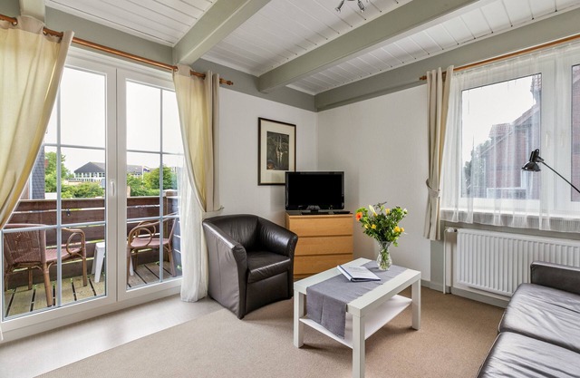 Ferienwohnung 'Atlanta 210' mit gemeinsamer Terrasse, privatem Garten und WLAN