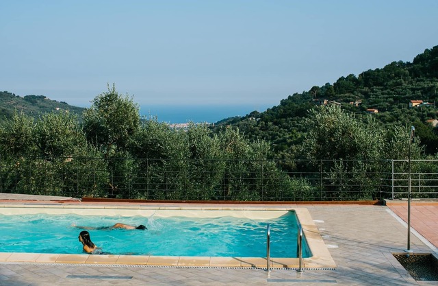 Apartment "Bilocale Mare" mit Bergblick, Pool, WLAN, Klimaanlage, Terrasse und Garten