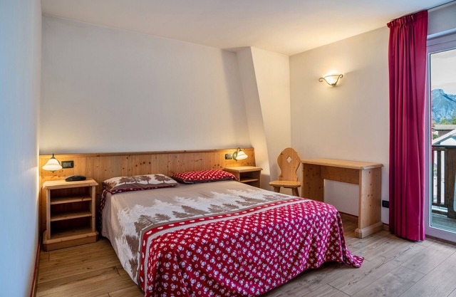 Ferienwohnung 'Giongo Residence Aparthotel 103' mit Bergblick, Gemeinschaftsterrasse und WLAN