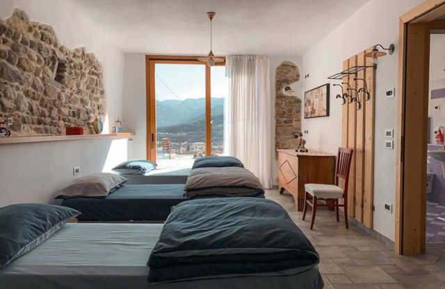 Ferienwohnung 'Quadrupla Piano Terra' mit Bergblick und privater Terrasse