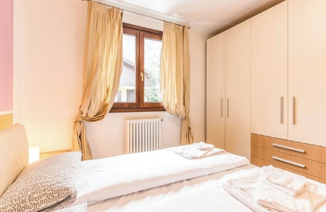 Ferienwohnung 'Rosa delle Dolomiti Bilocale1' mit Bergblick & gemeinsamer Sauna
