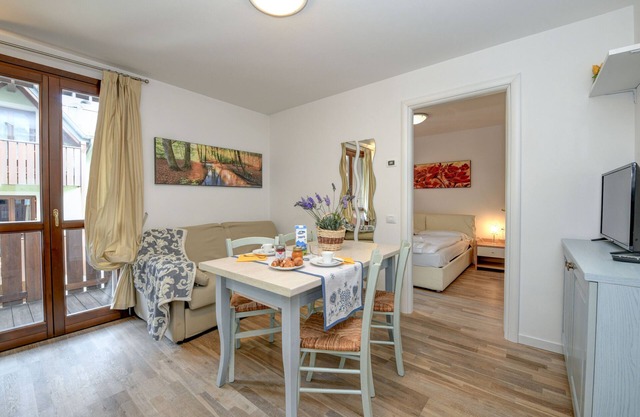 Ferienwohnung 'Rosa delle Dolomiti Bilocale2' mit Bergblick & gemeinsamer Sauna