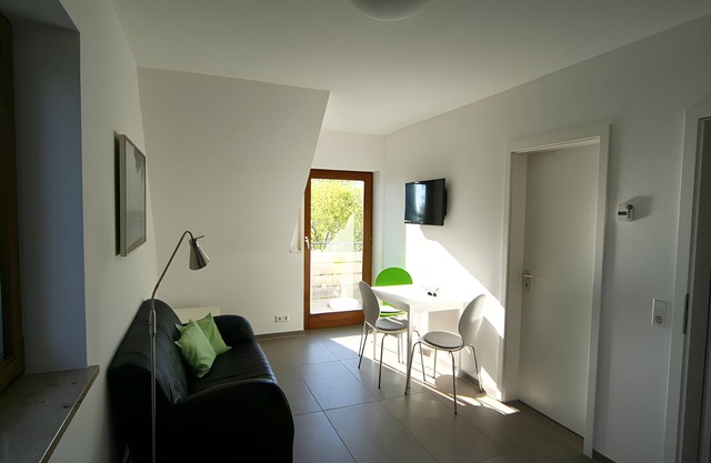 Apartment 'Sonnendeck mit Balkon' mit Seeblick, Gemeinschaftsterrasse und WLAN