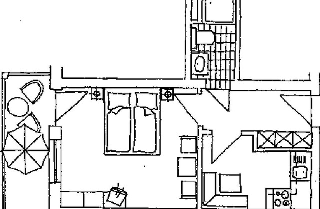 Appartement mit Kleinküche, gemütlicher Einrichtung und Balkon