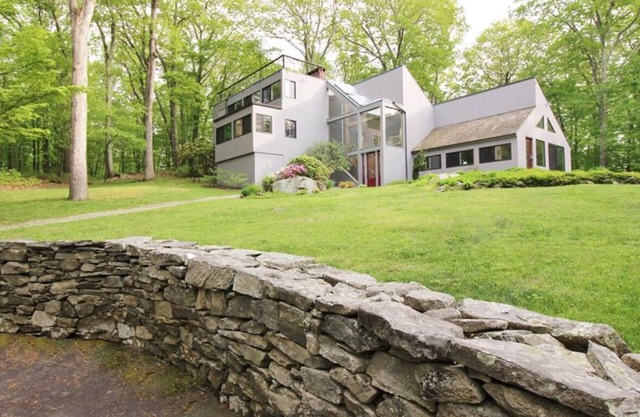 Architectural woodland retreat with trails, sauna, theater