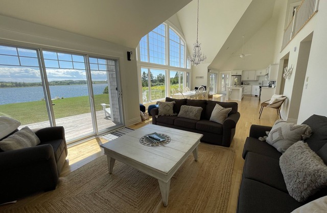 Stunning Waterfront Property With Screened In Dining & Hot Tub