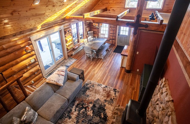 Authentic log cabin with cozy fireplace nestled in the woods