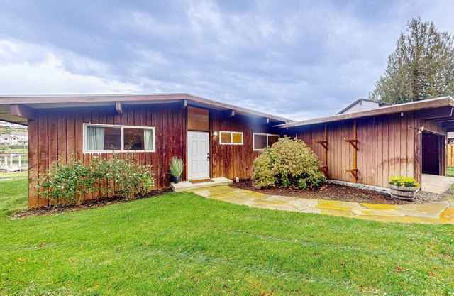 Bay-front dog-friendly home on one acre of land with modern interior & W/D