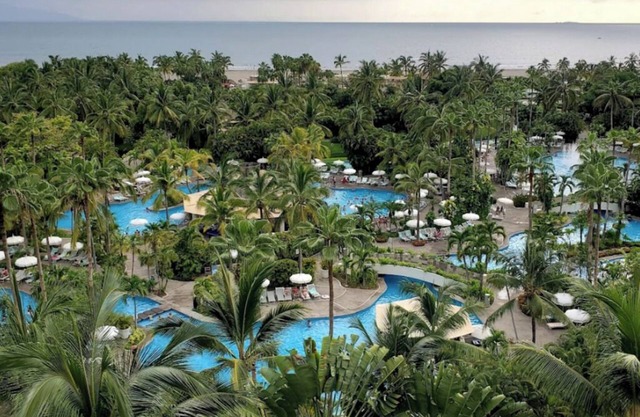 Beach resort w/balcony ft lush pools, dining, fitness, spa & resort activities.