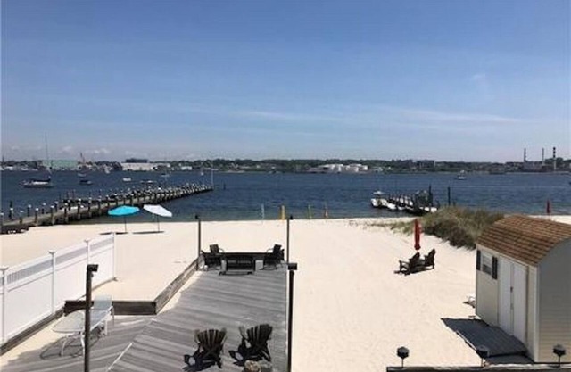 Beachfront Bliss: Water Front, Steps to Sand, Minutes from Dining & Attractions!