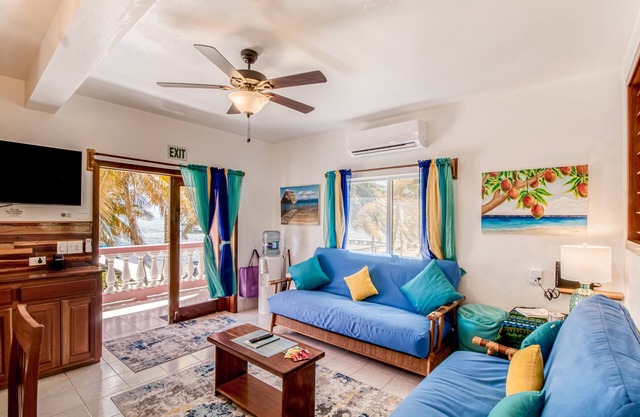 Beachfront condo with beach access, dock, pool, balcony, & ocean views