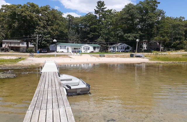 Beachfront retreat on beautiful Tallman lake near HuronManistee National Forest.
