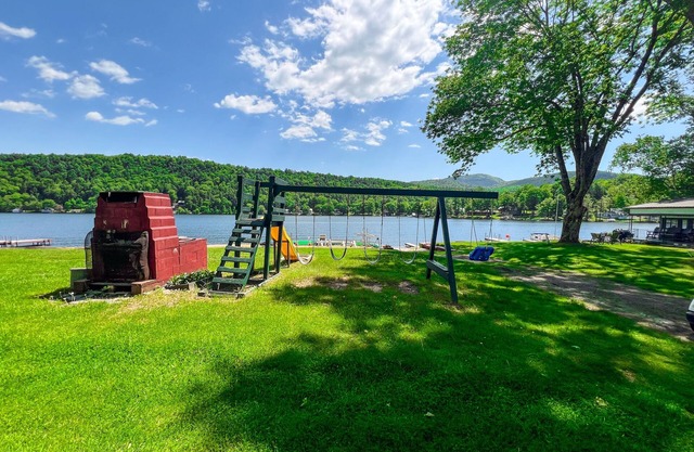 Beautiful and serene cottage with beach, dock, lake views, fishing, and A/C