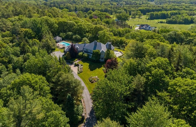 Spacious four bedroom home with distant water views and a heated pool!
