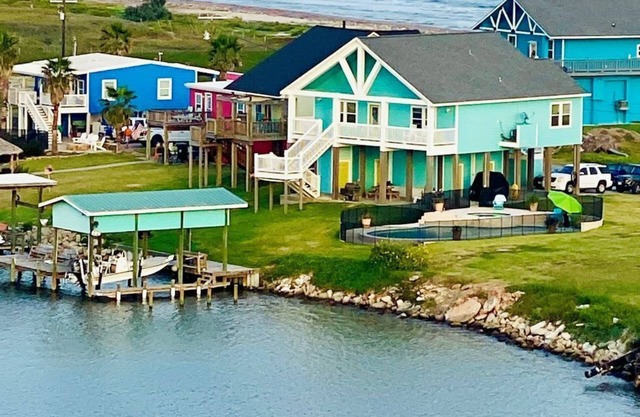 Beautiful beach house boasts a scenic water view from its front and back doors.