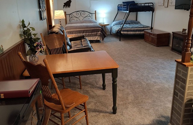 Beautiful cabin situated on wooded land with nice yard clearing and small stream