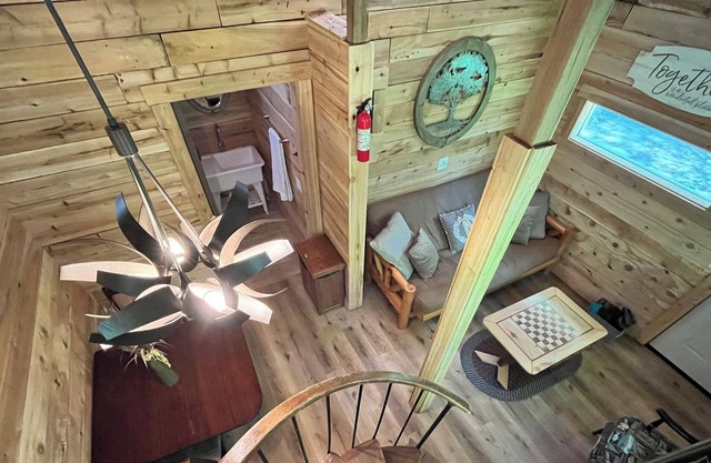 Beautiful cedar treehouse that has wall-to-wall windows, forest and river view!