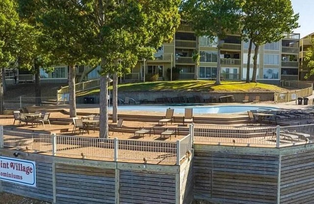 Beautiful condo with spectacular water view overlooking lakeside pool and deck.