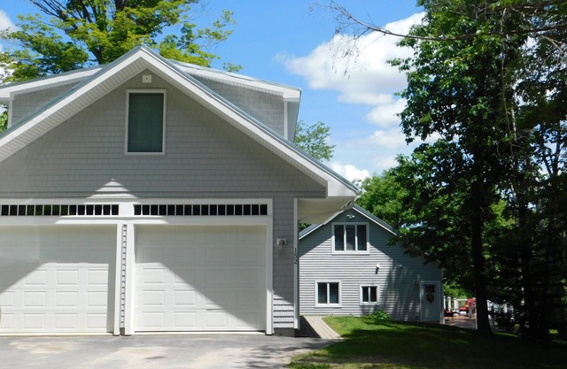 Beautiful home on Sebago Lake Basin with expansive yard and sandy beach!