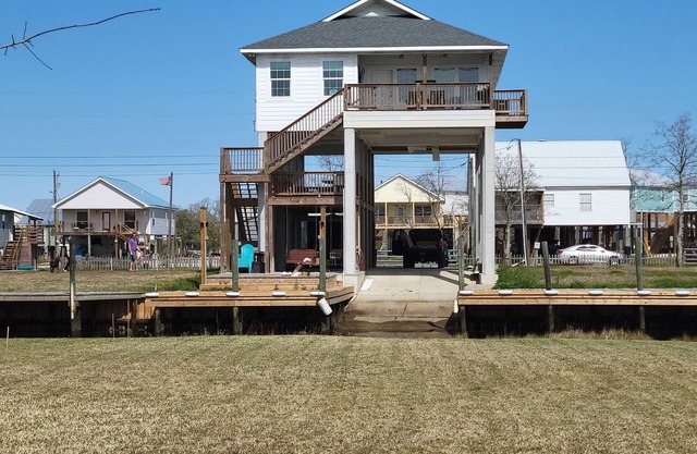 Beautiful new waterfront property with boat launch and great mid-level deck!