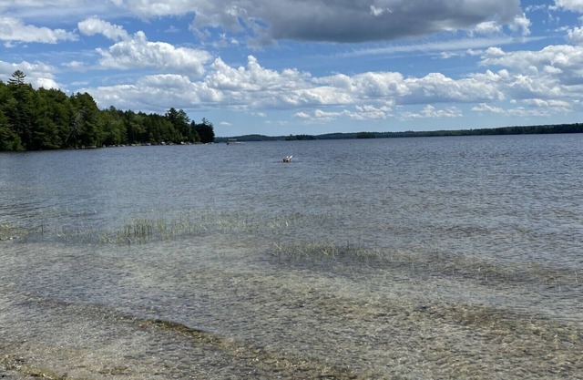 Beautiful private beach area within steps from the modern updated log home