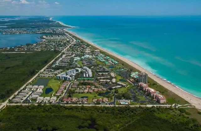 Beautifully renovated beach front condo in a private golf community