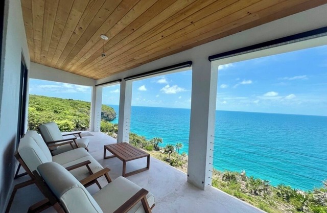 Big Pink: mid-century modern 2bedroom oceanfront home on cliffs of Gregory Town