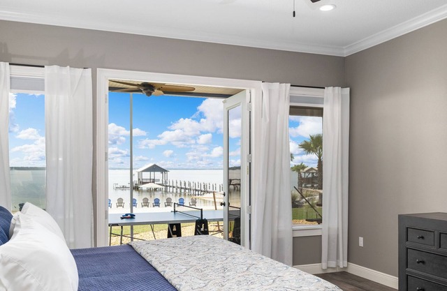 Blue Haven on Lake Weir with white sandy beach and fishing off of the dock