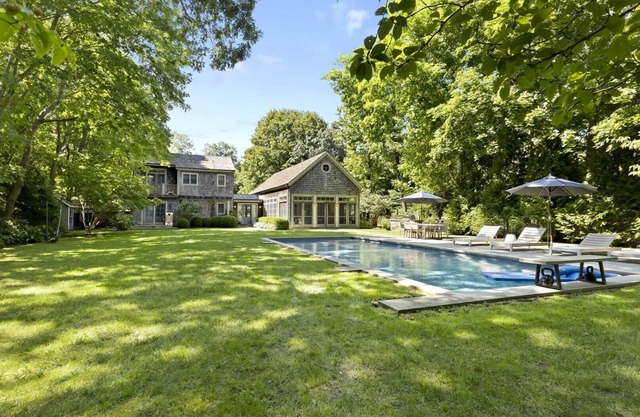 Boho-style home with a private pool, pool house, hot tub, complete...