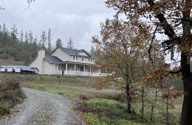 Breathtaking home with private historic bridge on a charming creek