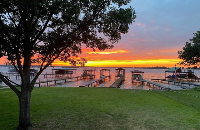 Bright, open concept, lakefront house on open water with amazing sunset views!