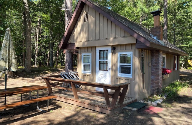 Cabin 3 on the bank of the Autrain River next to the Hiawatha Forest.