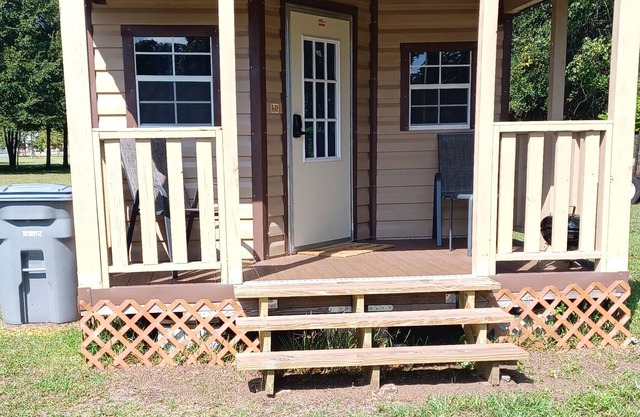 Cabins alongside Railroad Tracks