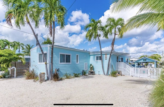 Canal Front with Bay Access Home and private sandy beach.