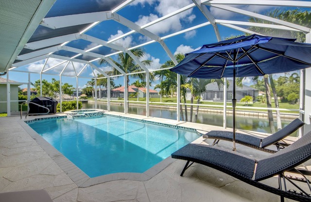 Capacious 4 BR/3 bath waterfront Villa with heated pool, spa, kayaks and bikes