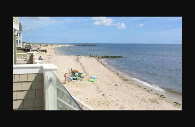 Cape Cod Condo 2 balconies. Heated Pool next to Ocean. Private Beach