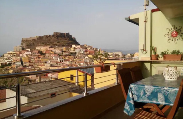 A TERRACE ON THE SEA AND THE MEDIEVAL VILLAGE ...